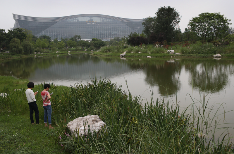 That mothership-like monolith is Earth’s largest building. Inside is a manmade beach. Image: John Moore/Getty Images
